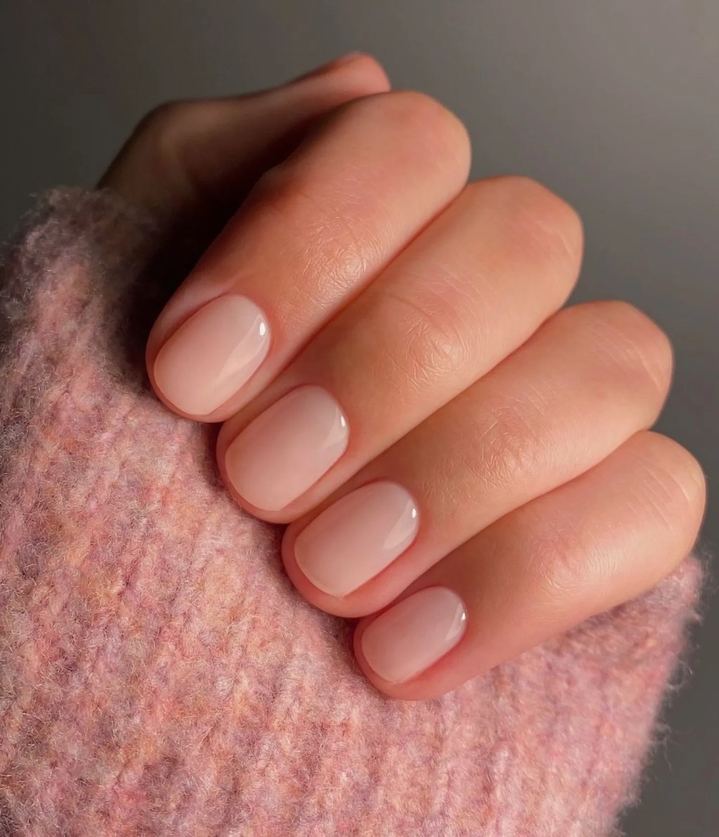 simple short milky nails with subtle pink polish color