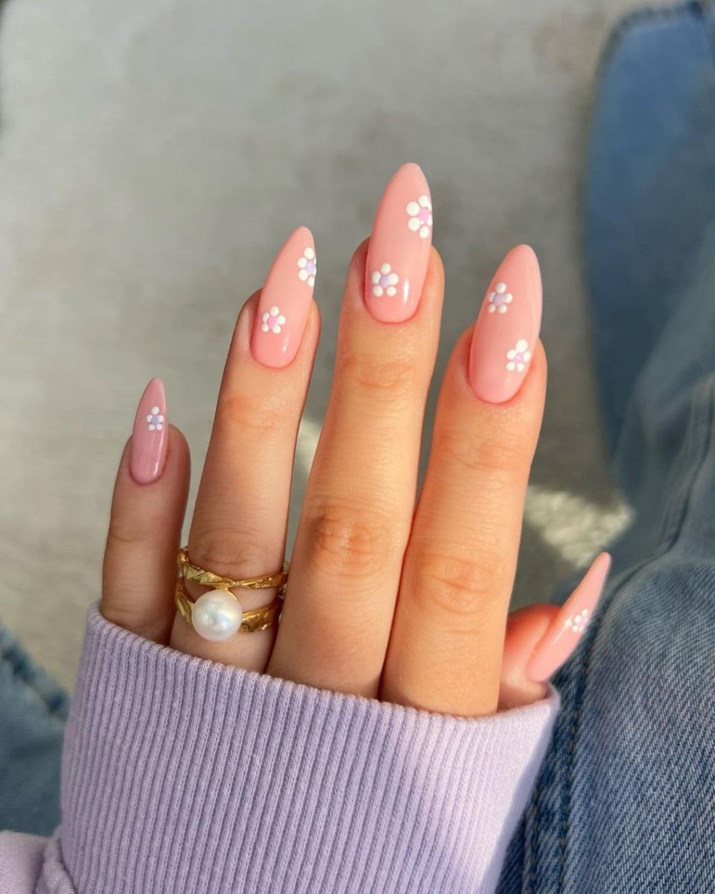 classy almond shaped pink spring nails with pastel flower designs in light purple and white colors