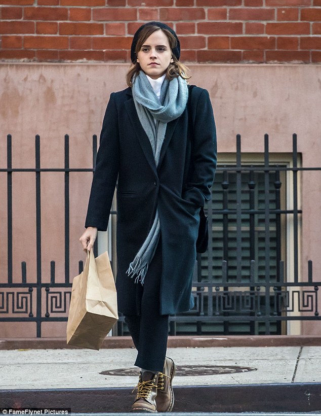 Effortless: Emma Watson wrapped up in stylish layers on Monday as she did a spot of shopping in New York