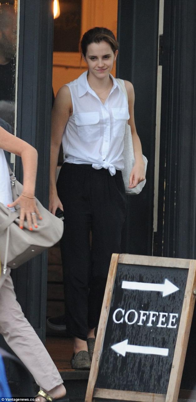 Summer ready: Emma Watson nails the off-duty look as she steps out with barely-there make-up and her hair swept into an updo