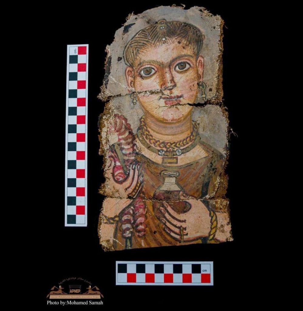 One of the newly discovered Fayoum mummy portraits. PH๏τo: Egypt's Ministry of Tourism and Antiquities.