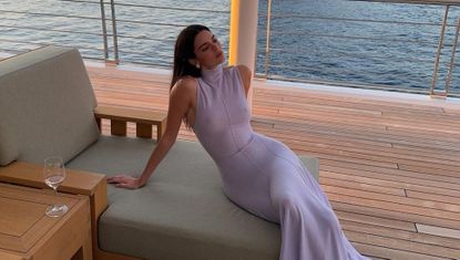 Kendall Jenner wears a semi sheer dress on a yacht in spain