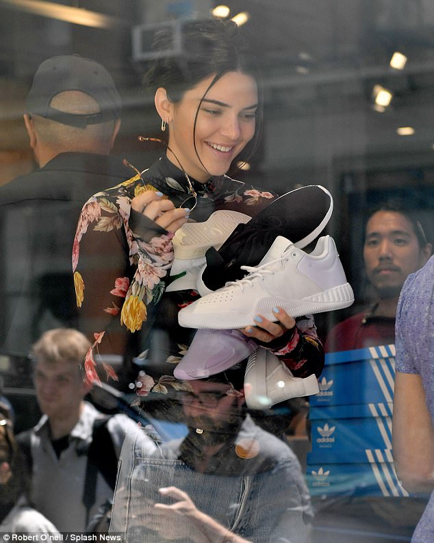 The merch: Kendall, the brand ambᴀssador for Adidas Originals, had a huge smile on her face while at a Manhattan location of Adidas on Monday