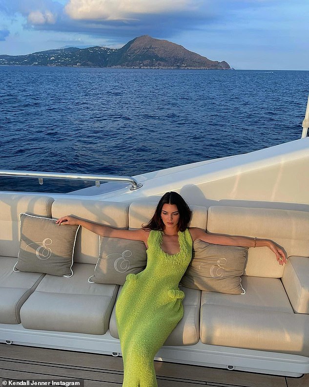 Kendall Jenner is a vision of luxury as she strikes poses on a yacht wearing chic neon green dress | Daily Mail Online