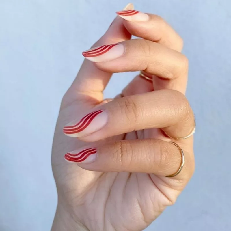 Wavy Red nail design on bare nails