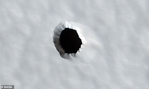 A mysterious hole on Mars has sparked speculations that it could be a gateway to ancient alien life