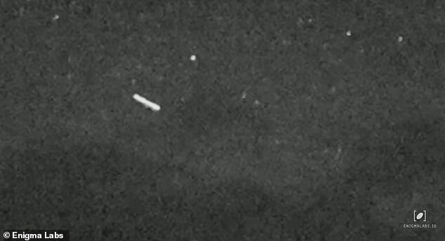 A bright white, glowing UFO - in a classic 'cigar'-shape common to these airborne mysteries - was caught on military-grade night vision this month by a Montana local (above)