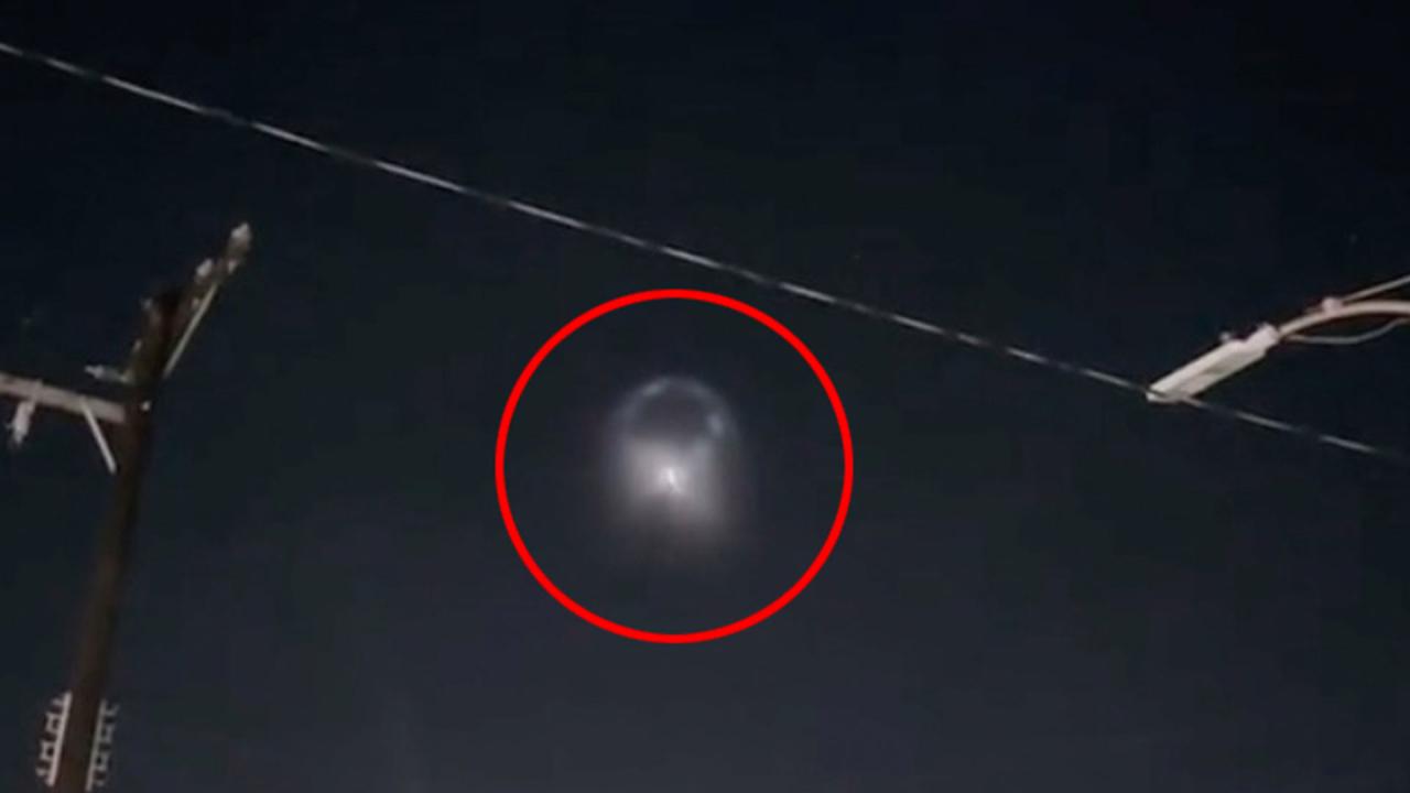 Eerie video shows ‘disc-shaped’ UFO cruising over town – sparking invasion fears