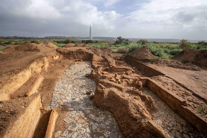 The site of recently unearthed archaeological ruins showcases stone flooring in between structural walls