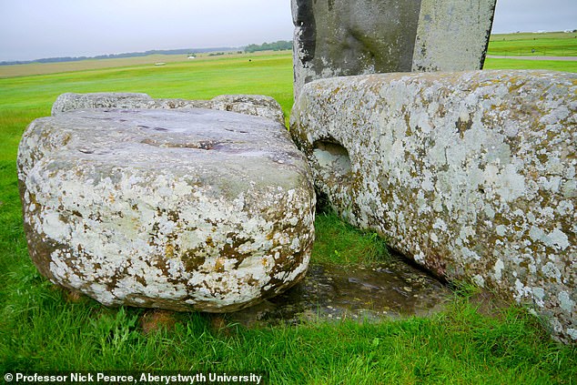 Last month, the plot thickened as scientists made a bombshell discovery that the stone circle's altar stone (pictured beneath two large sarsen stones) could be traced back to Scotland, rather than Wales