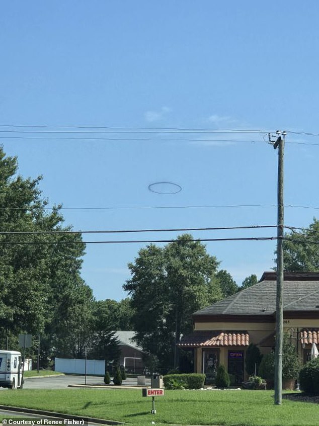 Renee Fisher snapped this pH๏τo of the mysterious black ring was taken in a neighborhood in the Waller Mill area of Williamsburg