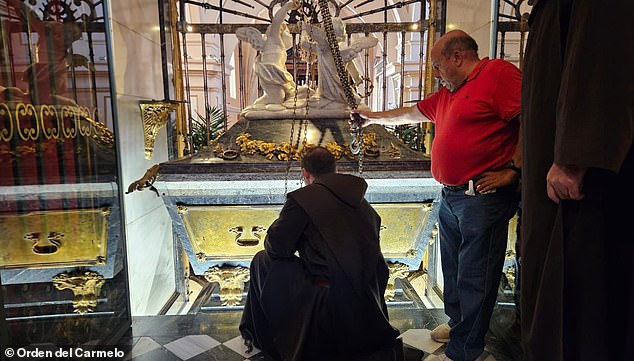 Saint Teresa of Avila died in 1582 and her body has remained largely unchanged since then. Pictured: The silver coffin encased in marble of Saint Teresa of Avila