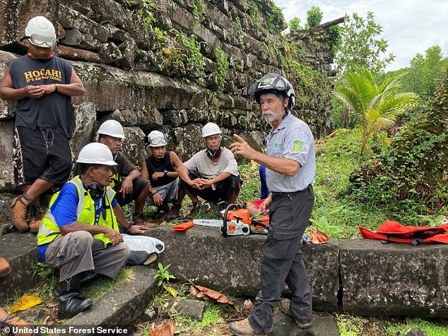 Above, Arbor Global's Kevin Eckert walks through chainsaw 'maintenance and safety' lessons with a local crew hoping to protect and preserve the ancient city of Nan Madol