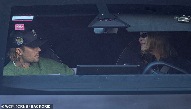 The Baby hitmaker opted for the pᴀssenger seat while Hailey sat behind the wheel as they left an office building together in their sleek Tesla vehicle