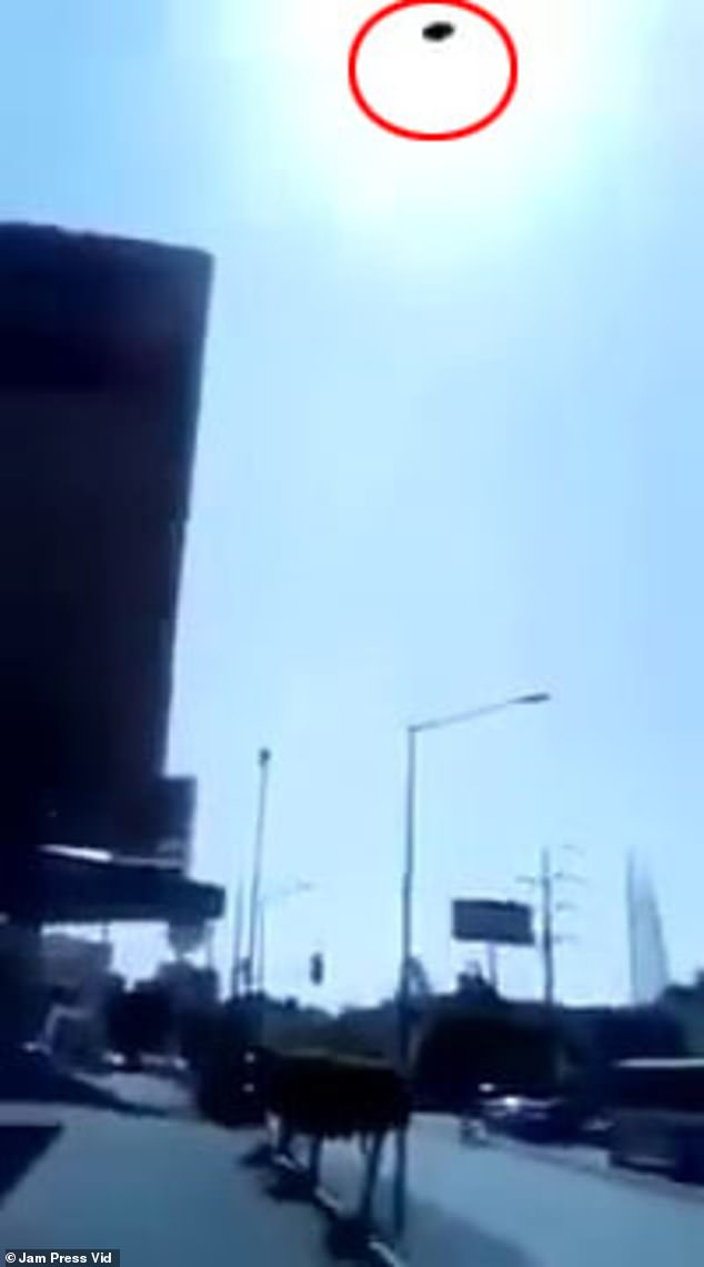 Residents in the south central Mexican town of Cuernavaca claimed to have recorded the moment a UFO appeared hovering near a gas station in broad daylight