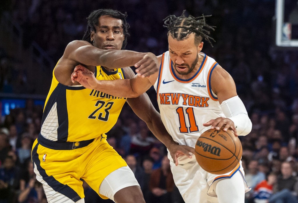 Jalen Brunson, who scored a game-high 26 points, drives past Aaron Nesmith during the Knicks' win.