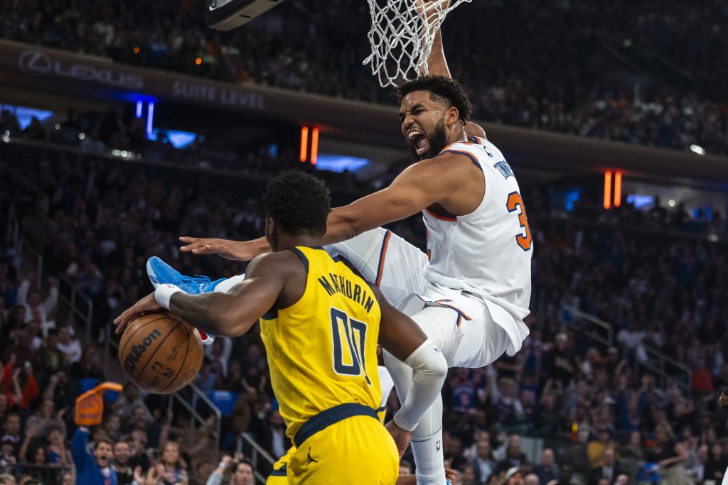 Karl-Anthony Towns, who scored 21 points and grabbed 15 rebounds, slams home a dunk during the Knicks' 123-98 win over the Pacers.