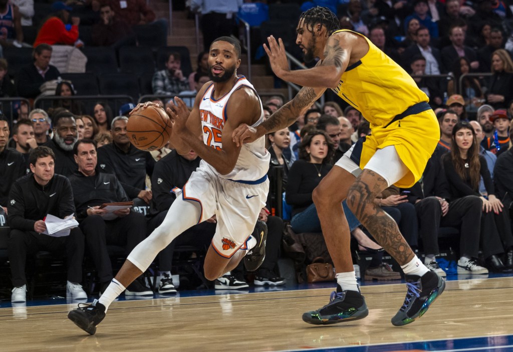 Mikal Bridges drives past Obi Toppin during the Knicks' win over the Pacers.