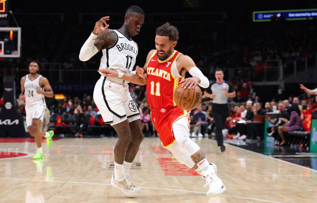 Trae Young, who scored 28 points, drives on Dennis Shroder during the Nets' Game 1 loss.