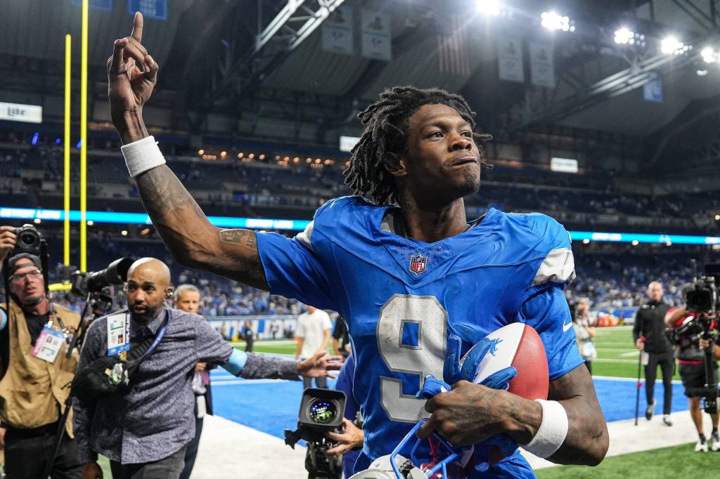 Detroit Lions wide receiver Jameson Williams (9) waves at fans to celebrates 26-20 overtime win over Los Angeles Rams as he exits the field at Ford Field in Detroit on Sunday, September 8, 2024.