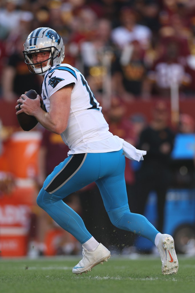 Andy Dalton #14 of the Carolina Panthers looks to pᴀss the ball against the Washington Commanders at Northwest Stadium on October 20, 2024 in Landover, Maryland. 