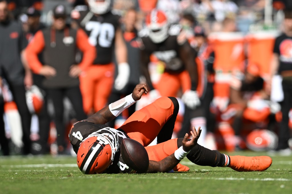 Deshaun Watson #4 of the Cleveland Browns falls to the ground after being injured on a play in the second quarter of a game against the Cincinnati Bengals at Huntington Bank Field on October 20, 2024 in Cleveland, Ohio.