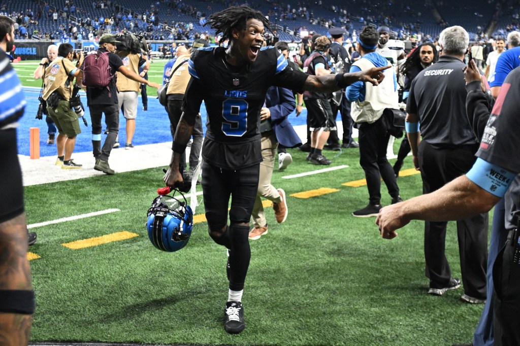 Lions wide receiver Jameson Williams (9) celebrates as he runs off the field after defeating the Seattle Seahawks at Ford Field