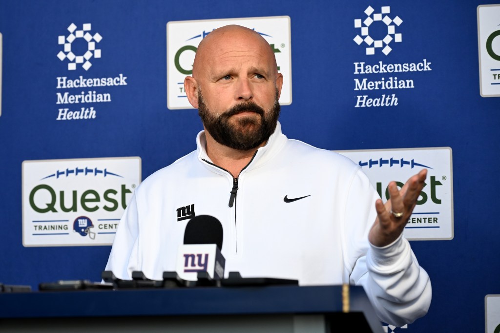 Giants head coach Brian Daboll standing in front of a podium, addressing reporters at a pre-practice press conference in East Rutherford, N.J. on October 30, 2024.