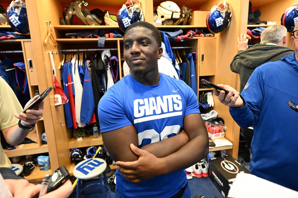 Giants running back Devin Singletary in a blue shirt, speaking to the media in East Rutherford, N.J.