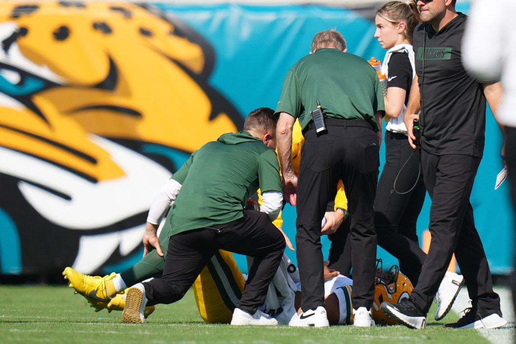 Jordan Love of the Green Bay Packers reacts on the field after an injury during the third quarter against the Jacksonville Jaguars at EverBank Stadium on October 27, 2024 in Jacksonville, Florida. 