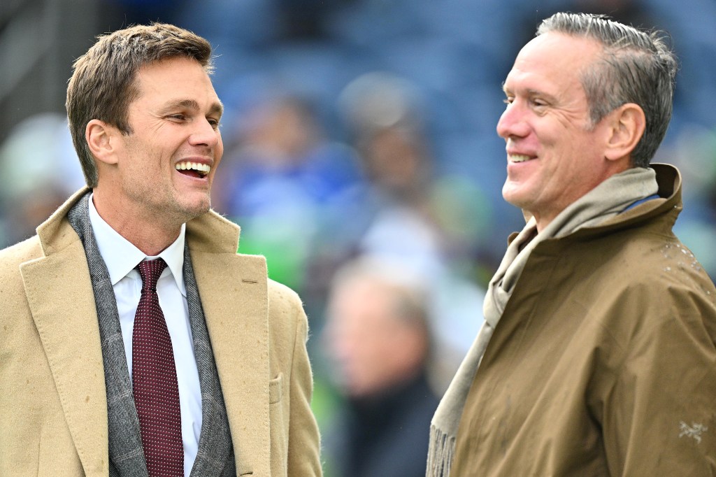 Tom Brady (L) talks with Drew Bledsoe (R) on the field prior to a game between the Seattle Seahawks and the Buffalo Bills at Lumen Field on October 27, 2024 in Seattle, Washington. 