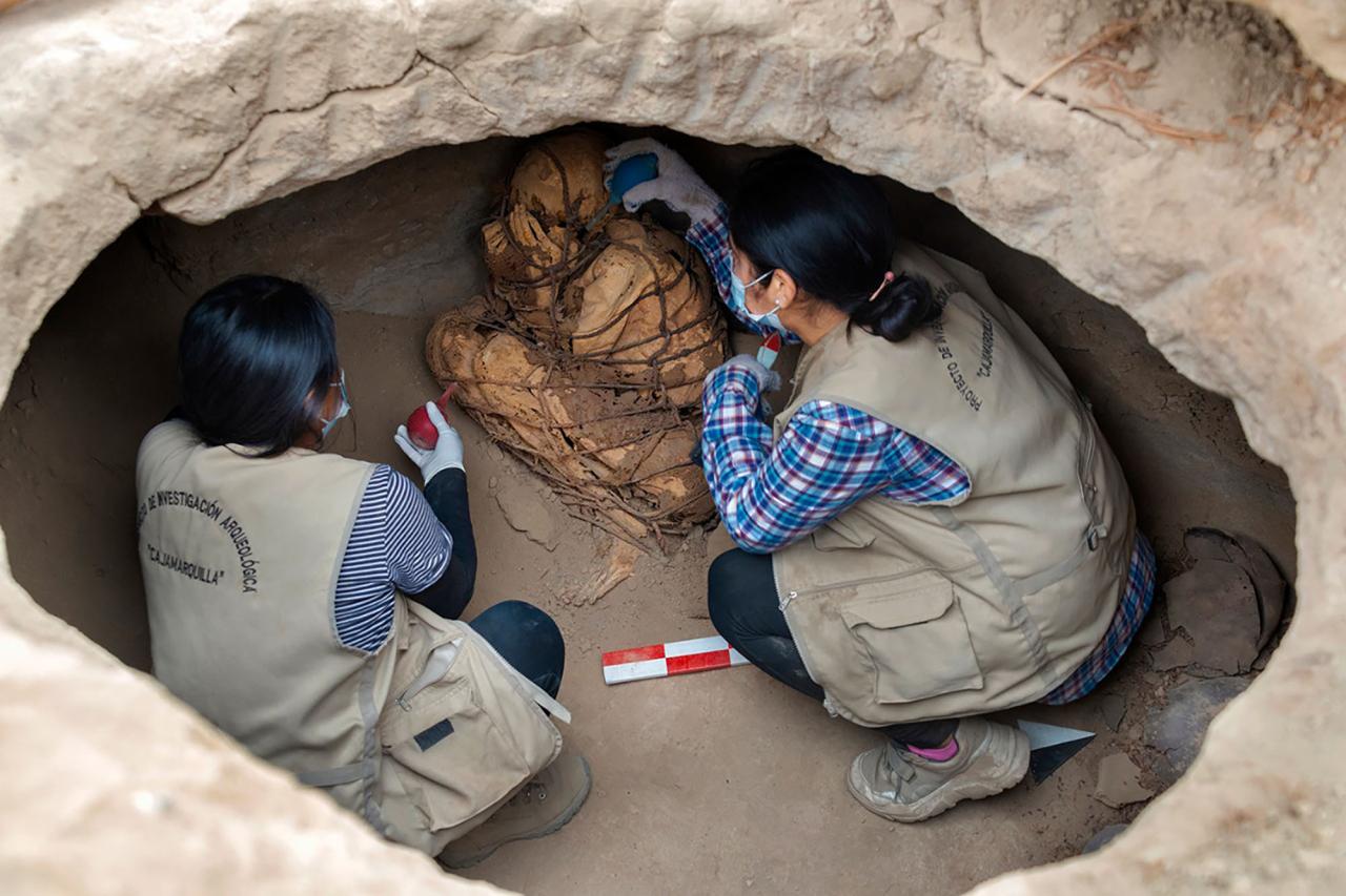 A mummy, fully bound in ropes and with its hands covering its face, has been discovered in an underground tomb in Peru.