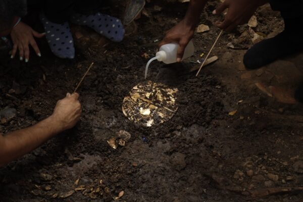 A golden object found in a 1,200-year-old tomb discovered by Panamanian archaeologists, along with victims of human sacrifice