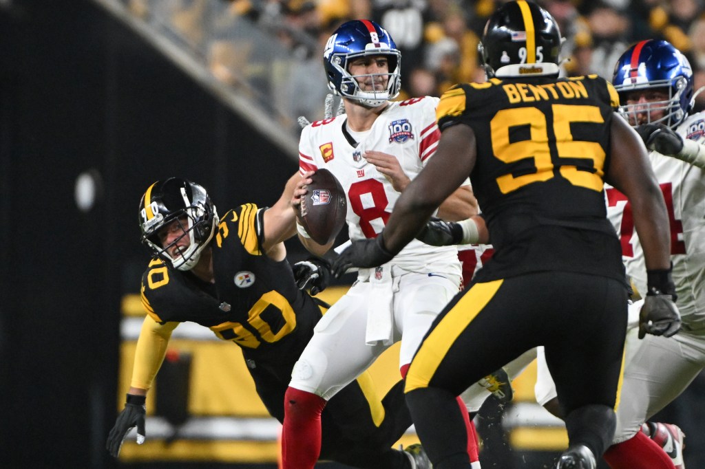 T.J. Watt (90) pressures New York Giants quarterback Daniel Jones (8) during the third quarter at Acrisure Stadium. 