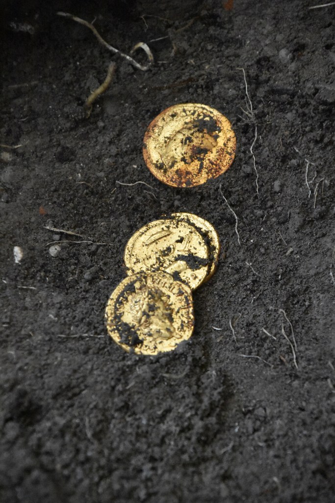 A woman's coins plus more treasures were also recovered at the site.