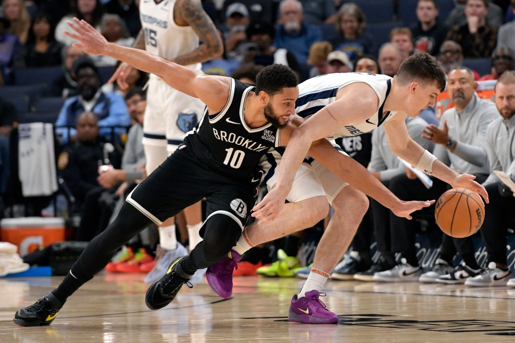 Ben Simmons reaches for the ball against Jake LaRavia during the Nets' loss.