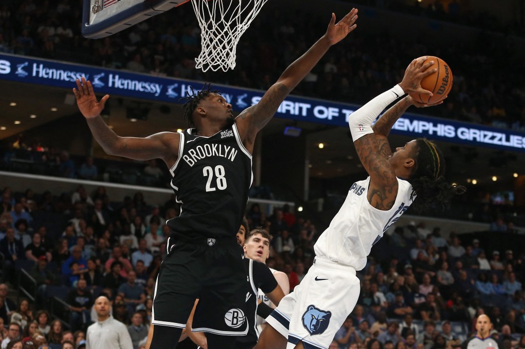 Dorian Finney-Smith defends Ja Morant during the Nets' win over the Grizzlies on Oct. 30, 2024. 