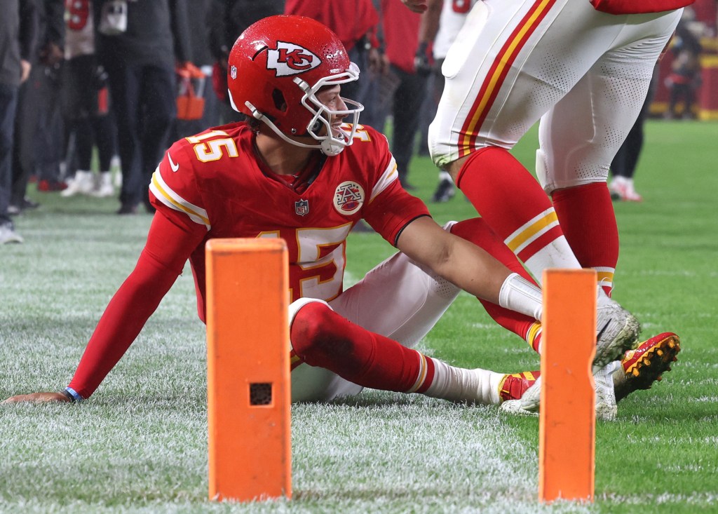 Patrick Mahomes #15 of the Kansas City Chiefs reacts after an apparent injury against the Tampa Bay Buccaneers during the fourth quarter at GEHA Field at Arrowhead Stadium on November 04, 2024 in Kansas City, Missouri.