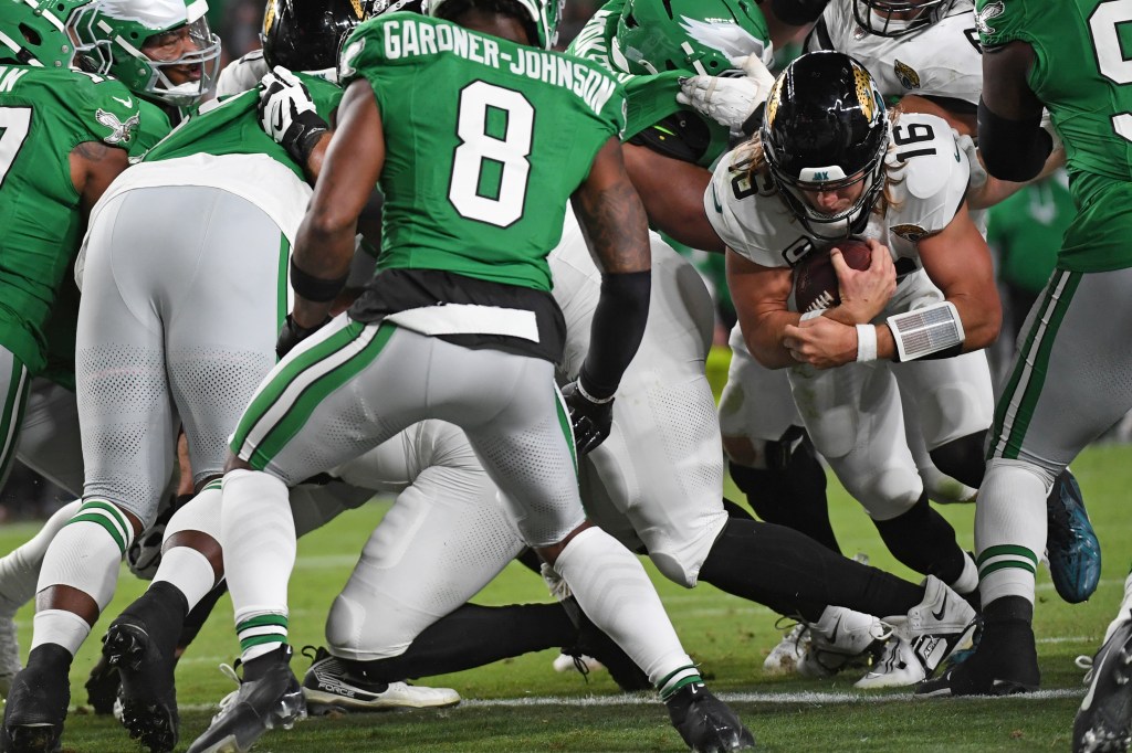 Jacksonville Jaguars quarterback Trevor Lawrence (16) scores on a 1-yard touchdown run during the third quarter against the Philadelphia Eagles at Lincoln Financial Field. 