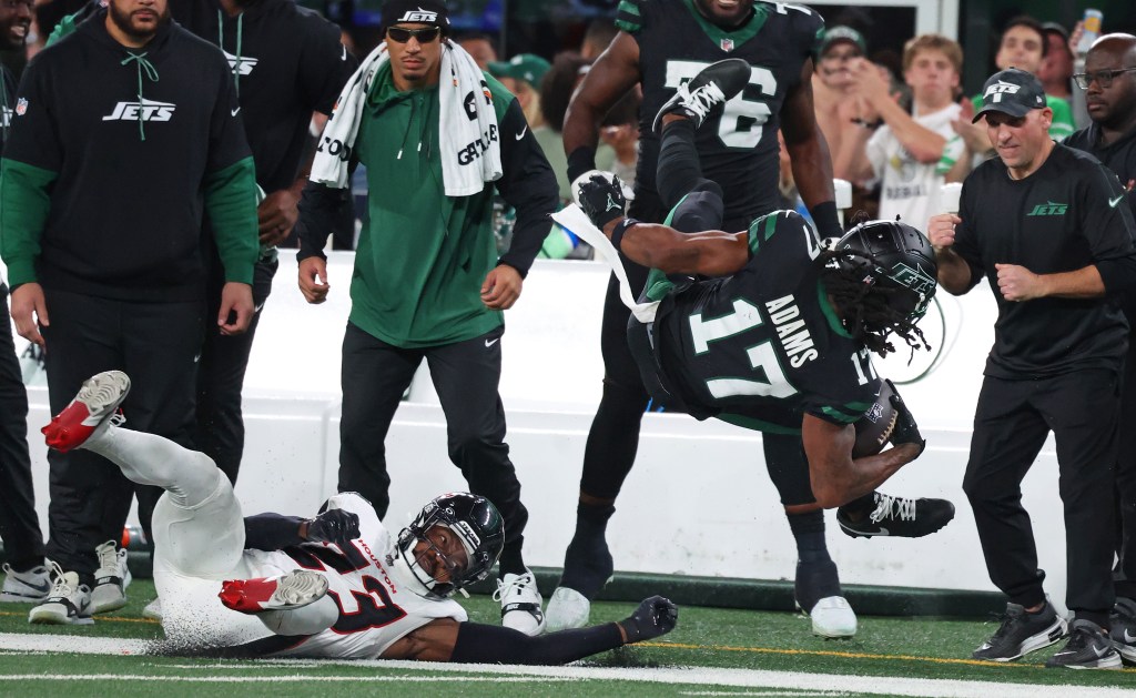 New York Jets wide receiver Davante Adams (17) makes a catch and crashes down during the second half when the New York Jets played the Houston Texans Thursday, October 31, 2024 at MetLife Stadium in East Rutherford, NJ.