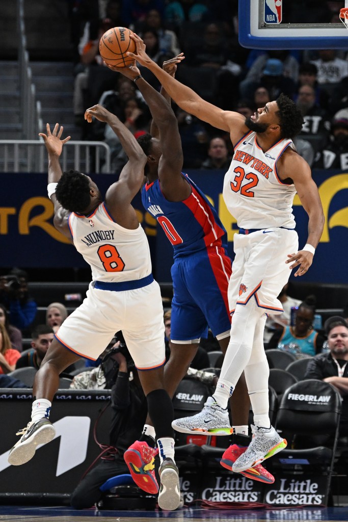 Detroit Pistons center Jalen Duren (0) has his sH๏τ blocked by New York Knicks center Karl-Anthony Towns (32) in the third quarter at Little Caesars Arena. 