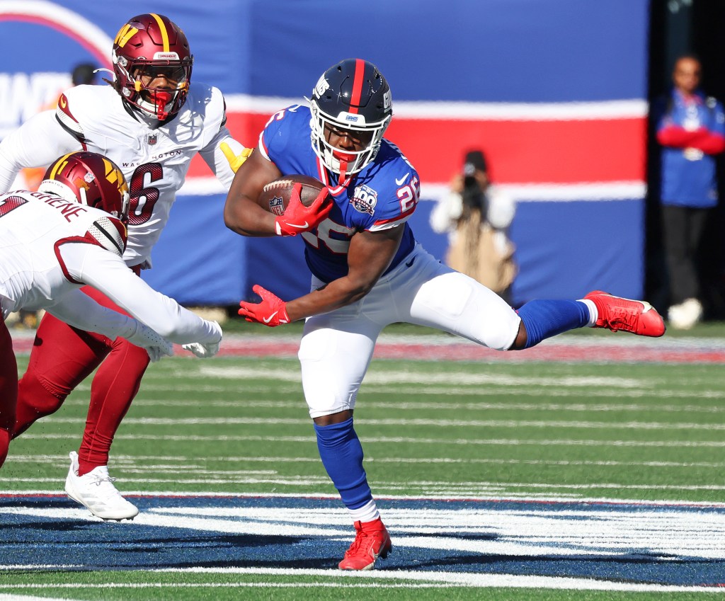 Devin Singletary runs with the ball during the Giants' loss to the Commanders on Nov. 3, 2024. 