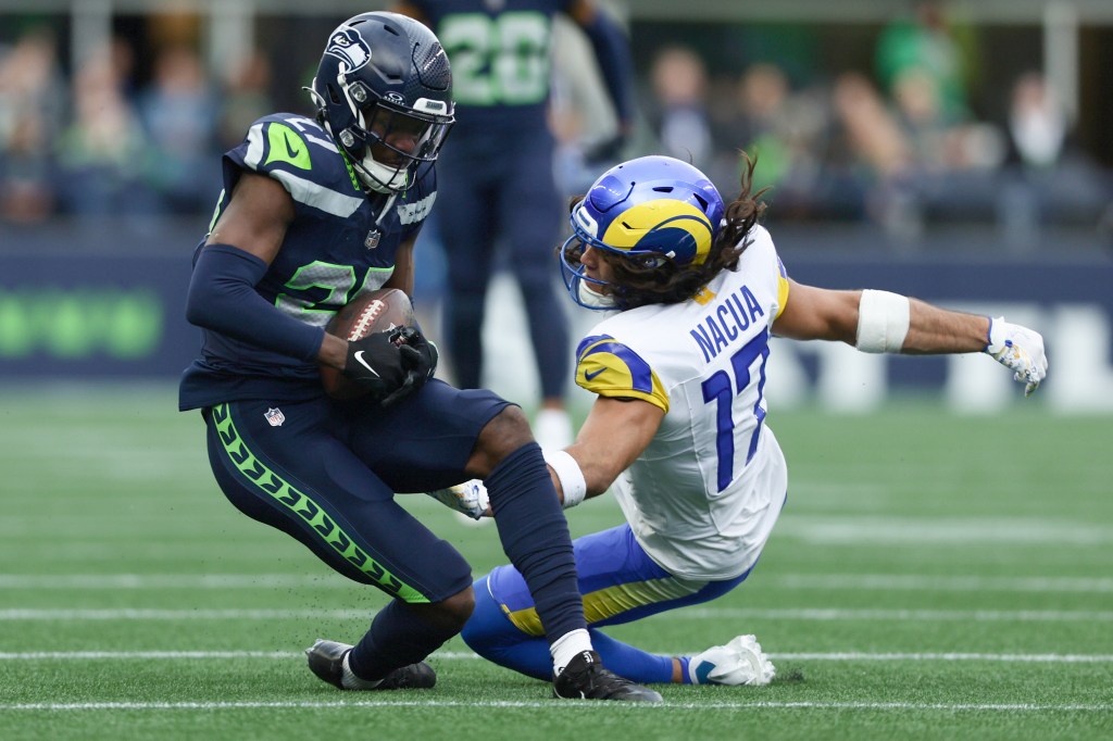 Riq Woolen #27 of the Seattle Seahawks intercepts a pᴀss intended for Puka Nacua #17 of the Los Angeles Rams during the second quarter at Lumen Field on November 03, 2024