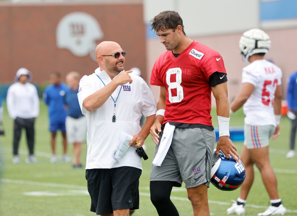 New York Giants head coach Brian Daboll speaking to New York Giants quarterback Daniel Jones #8, during practice at the New York Giants training facility in East Rutherford, New Jersey.