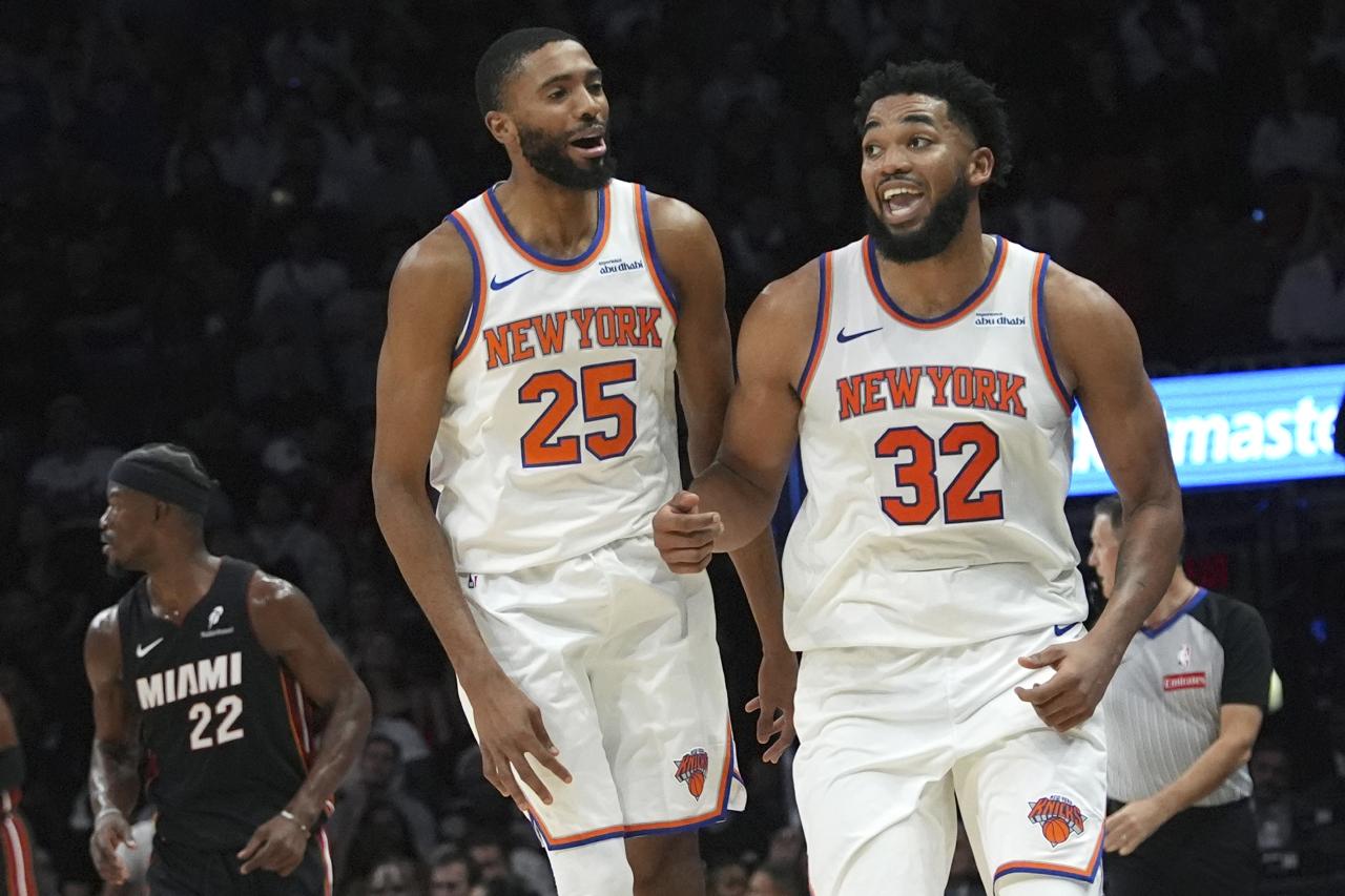 New York Knicks center Karl-Anthony Towns (32) celebrates after scoring during the second half of an NBA basketball game against the Miami Heat, Wednesday, Oct. 30, 2024, in Miami.