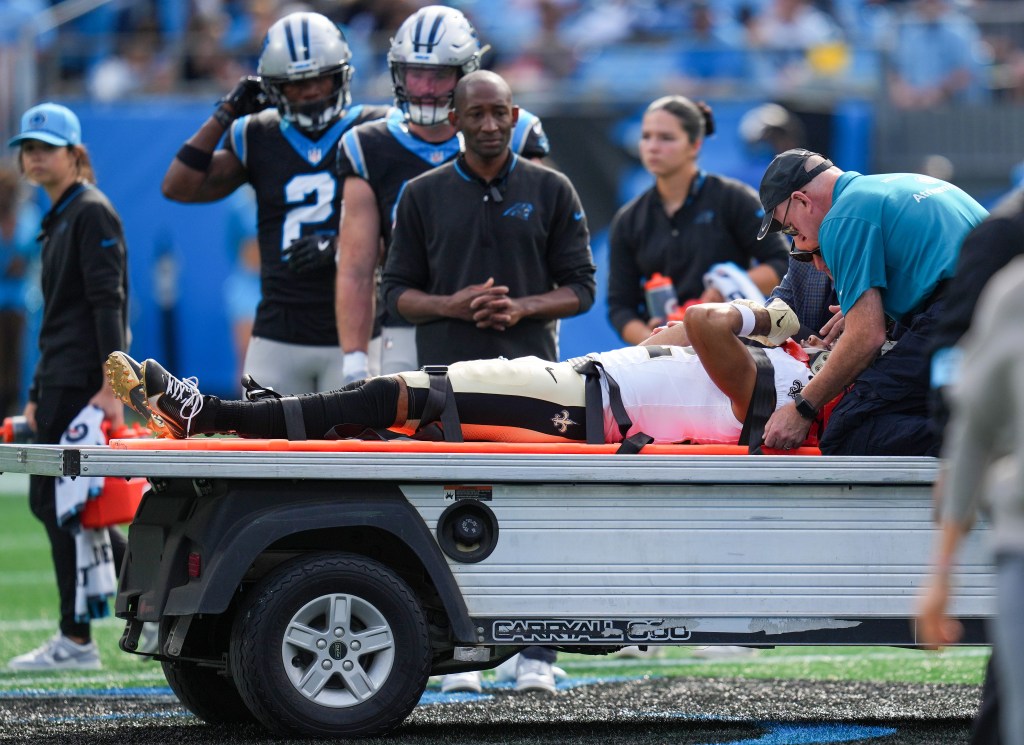 Saints receiver Chris Olave is carted off with a concussion on Nov. 3, 2024.