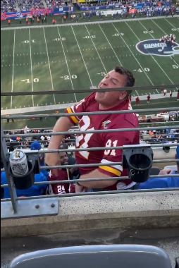 A Commanders fan yells at  other fans during his team's win over the Giants on Sunday.