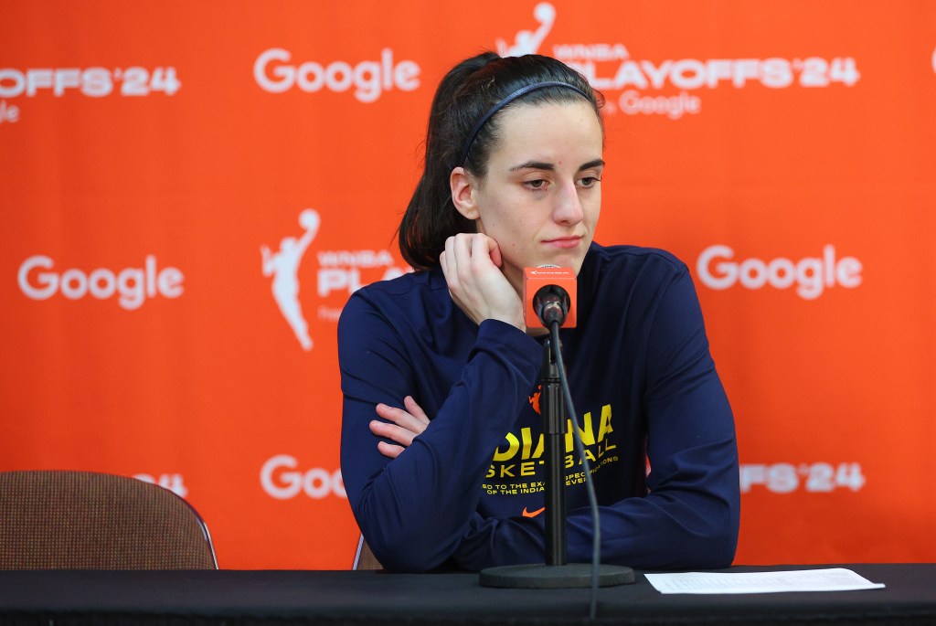 Caitlin Clark addresses reporters after the Fever lost to the Sun in Game 1 of their playoff series on Sept. 22.