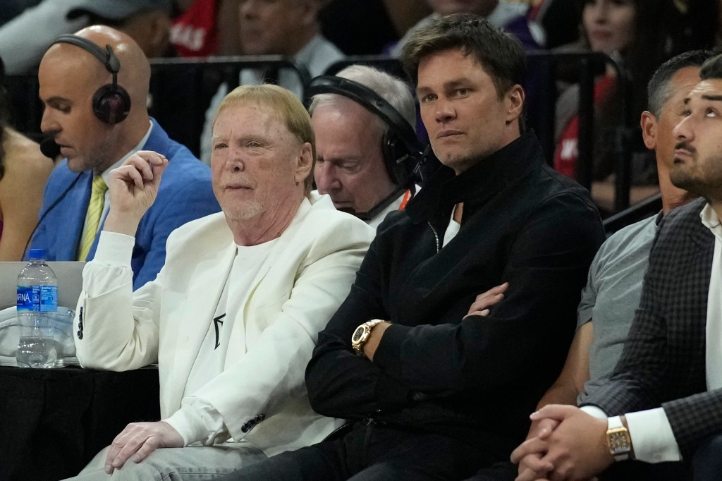 Brady alongside Raiders owner Mark Davis in October 2023.