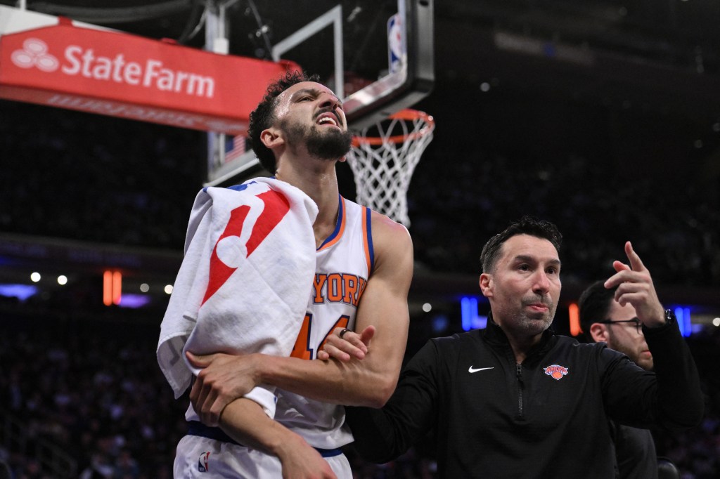 New York Knicks guard Landry Shamet (44) heading to the locker room after sustaining a shoulder injury during a game against the Charlotte Hornets at Madison Square Garden.